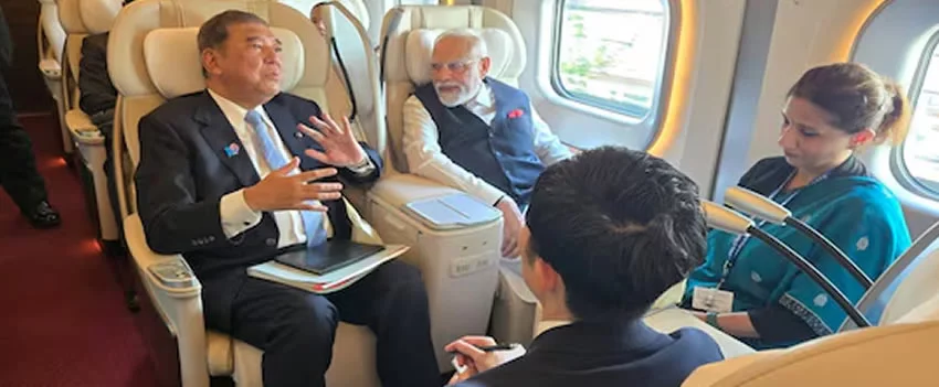 Primeiro-ministro Ishiba e Modi visitam Tóquio para explorar o Shinkansen e discutir o projeto ferroviário de alta velocidade na Índia, focando em segurança e inovação.